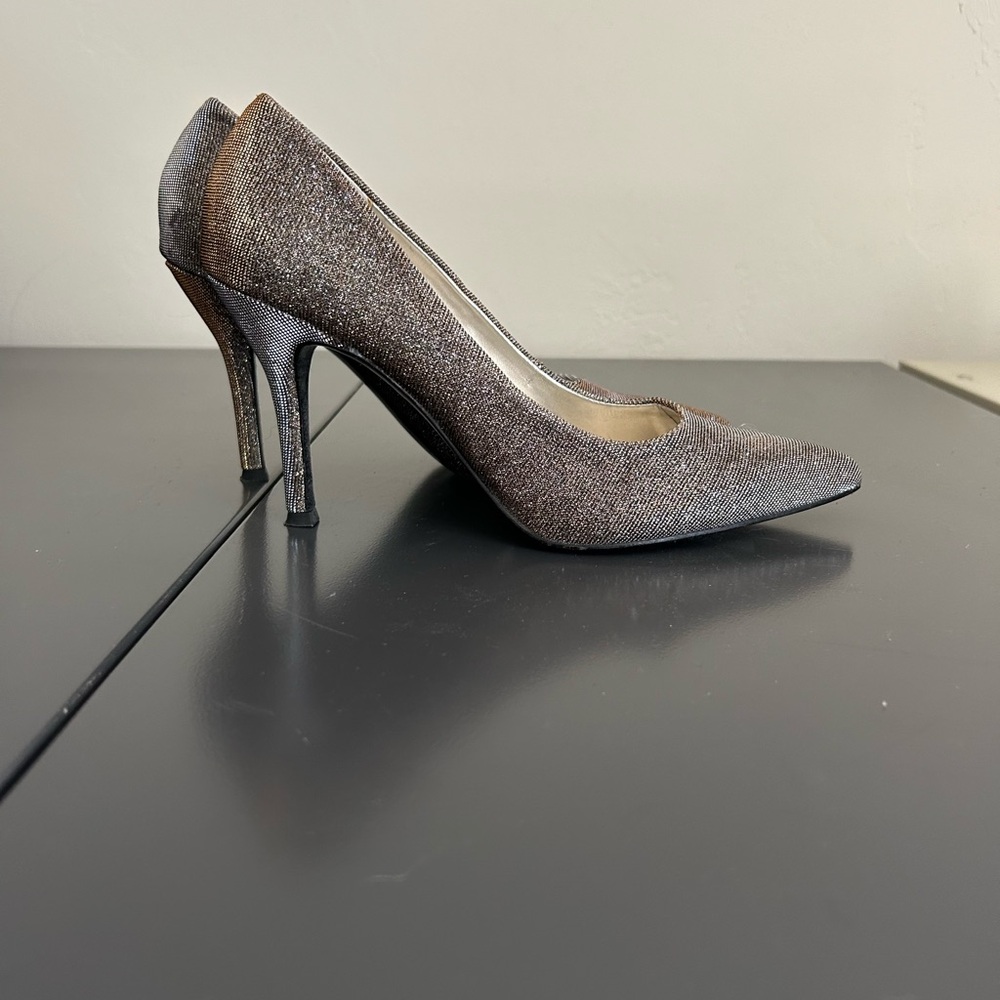 Women’s silver/gold (depending on the light) dressy pumps. Size 6.5, heel 3 1/2